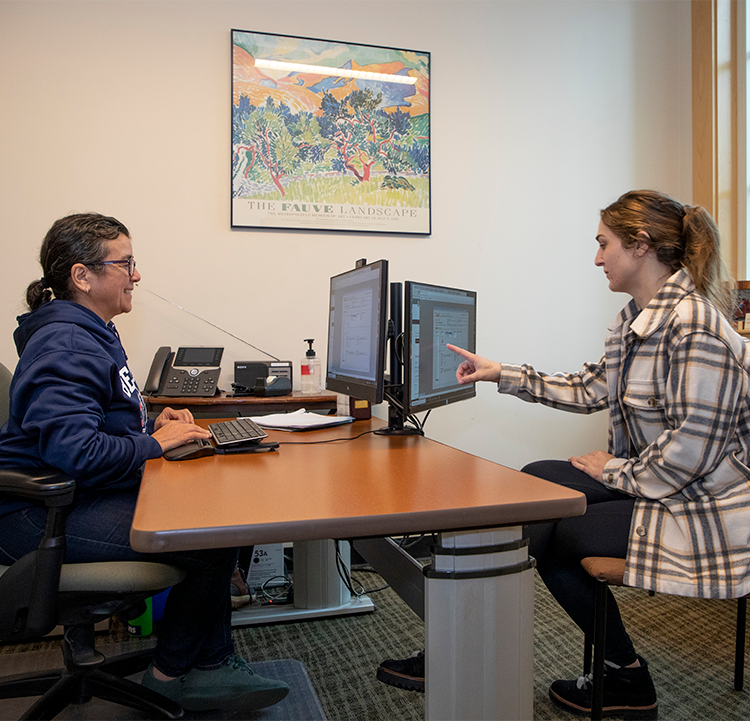 A female counselor discusses an educational plan with a female student at Santa Rosa Junior College.