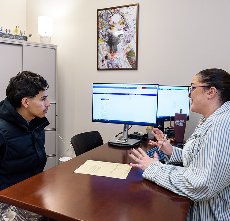 A male student discusses with a female counselor in one of the Counseling offices at Santa Rosa Junior College.