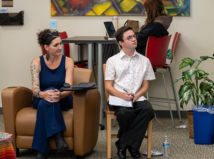 A female and a male counselor in the Disability Resources Department at Santa Rosa Junior College attend a webinar in the Intercultural Center at SRJC Petaluma.  